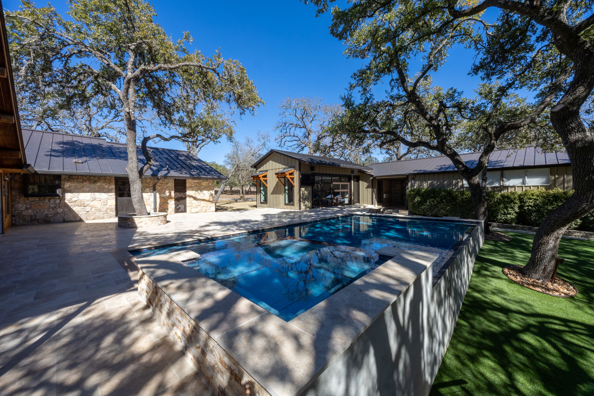 Pool with elegant lighting and water features